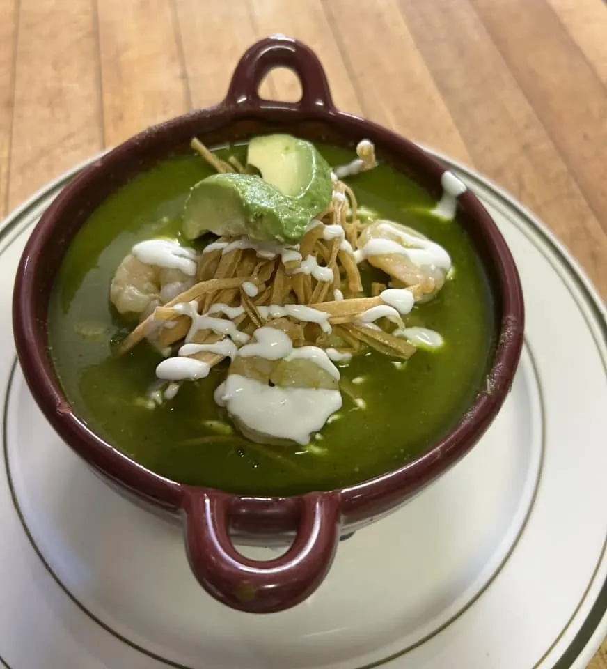 Chilaquiles verdes in a cast-iron dish